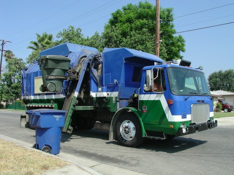 Commercial waste removal van outside a Mottingham shopfront