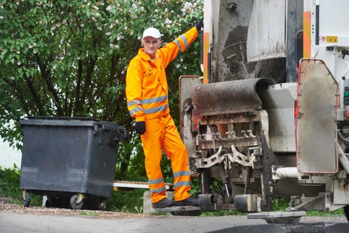 Waste clearance truck transporting debris