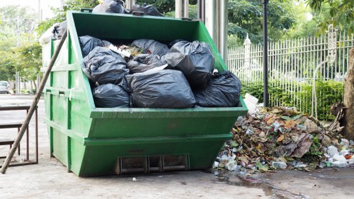 Employees following safety procedures at a commercial waste site